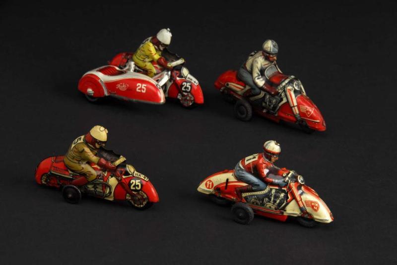 Appraisal: Lot of Tin Motorcycle Friction Wind-Up Toys Description German All