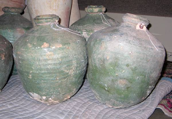 Appraisal: A group of three green glazed terra cotta storage jars