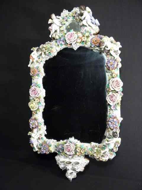 Appraisal: Sitzendorf fine German porcelain th century rococo style mirror Applied