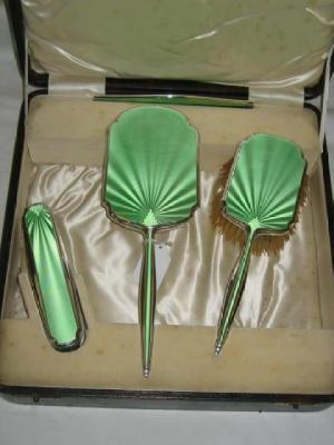 Appraisal: A FOUR PIECE GREEN ENAMEL BRUSH SET in case wide