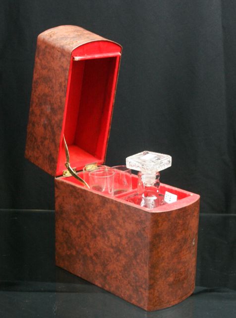 Appraisal: A book boxed crystal decanter together with three shot glasses