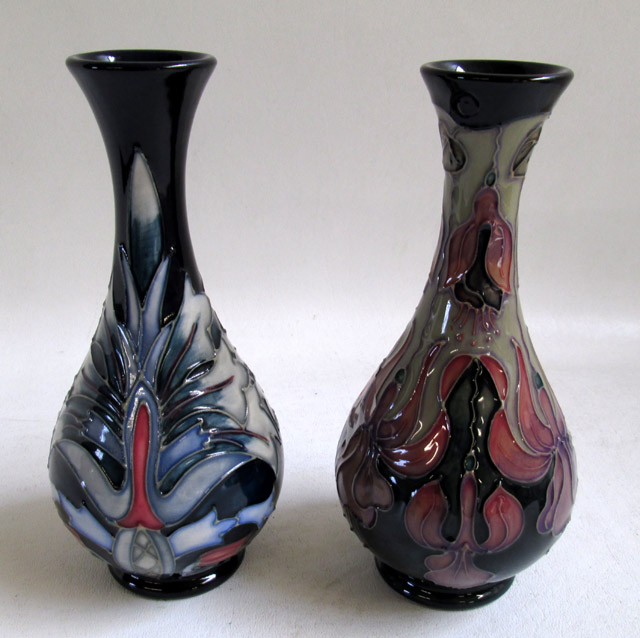 Appraisal: TWO MOORCROFT POTTERY VASES hand painted under glaze in hanging