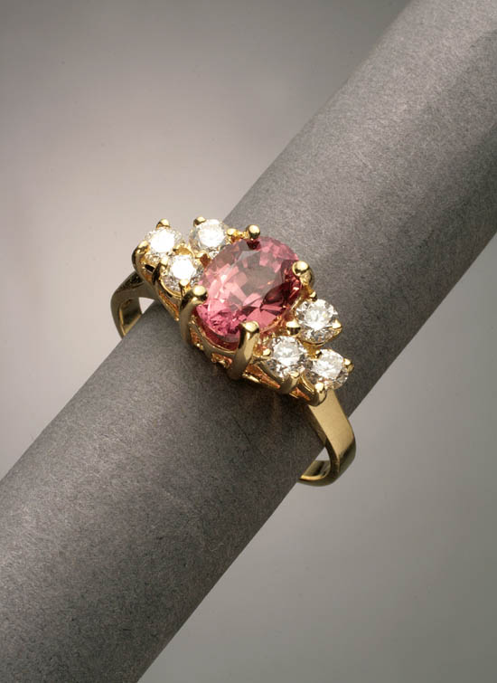 Appraisal: -Karat Yellow-Gold Pink-Orange Sapphire and Diamond Dinner Ring The four-prong