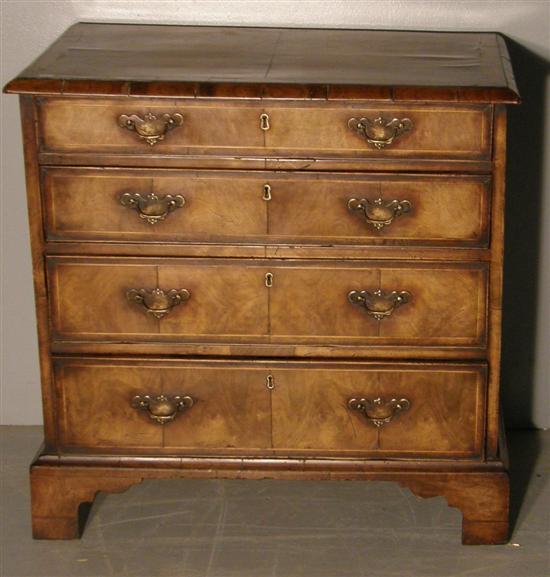 Appraisal: Walnut chest in th century style with four graduated drawers