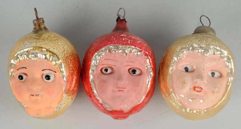 Appraisal: Lot of Girl Face Ornaments Description Some soiling on the