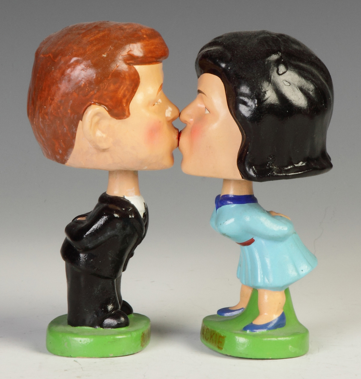 Appraisal: Kissing Kennedy Painted Composition Bobble Heads by The Novelty Co