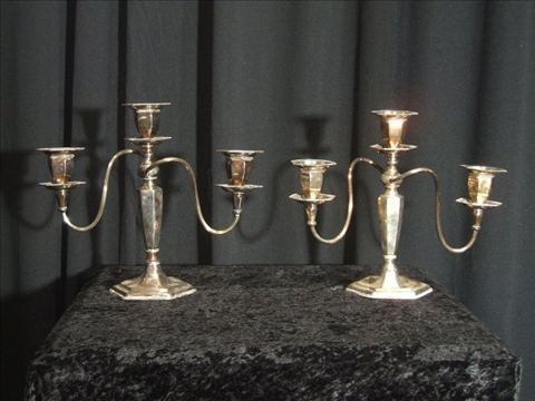 Appraisal: PAIR OF POOLE SILVER COMPANY THREE LIGHT CANDELABRA Rising from