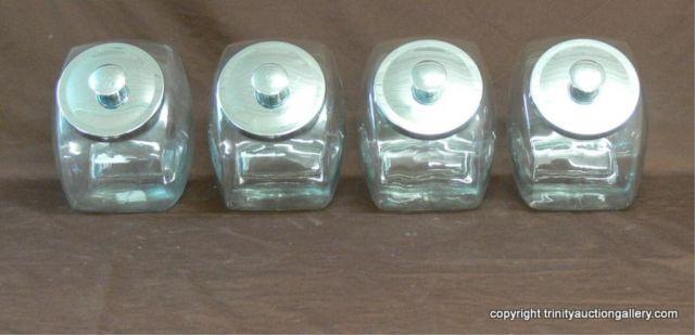 Appraisal: FOUR Glass Counter Top Canisters with Lids Resemble old time