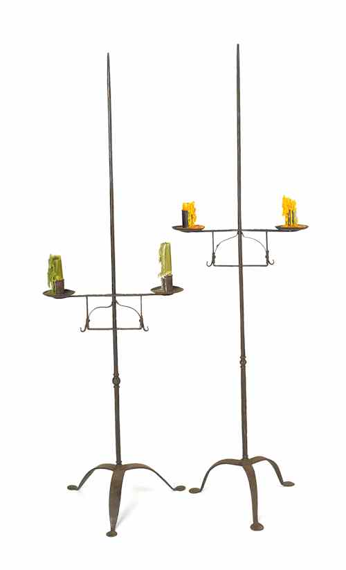 Appraisal: Pair of wrought iron candlestands th c h