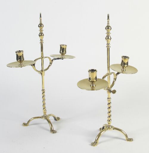 Appraisal: A pair of th century brass adjustable candelabra each with