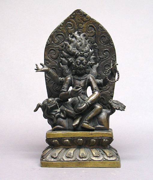 Appraisal: A cast Sino-Tibetan style bronze seated dharmapala th Century the