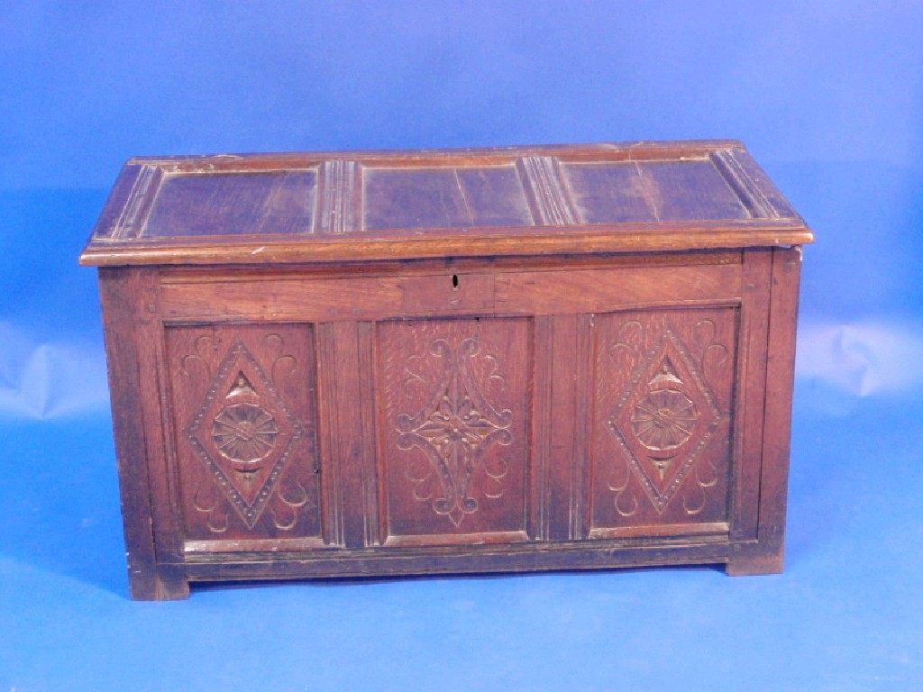 Appraisal: A thC oak coffer with three plain panels to the