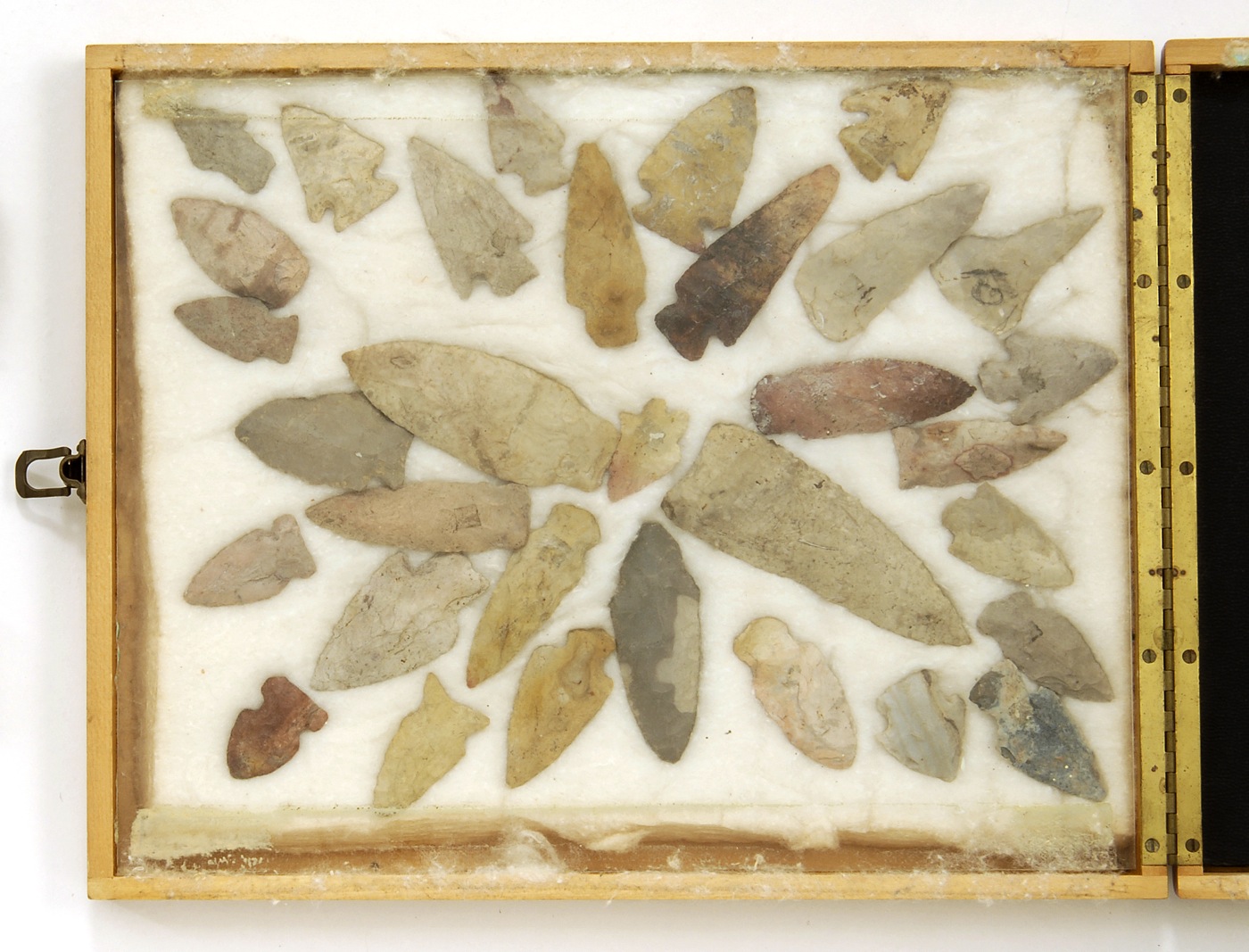 Appraisal: CASED COLLECTION OF THIRTY-TWO ARROWHEADS AND OTHER STONE ARTIFACTS