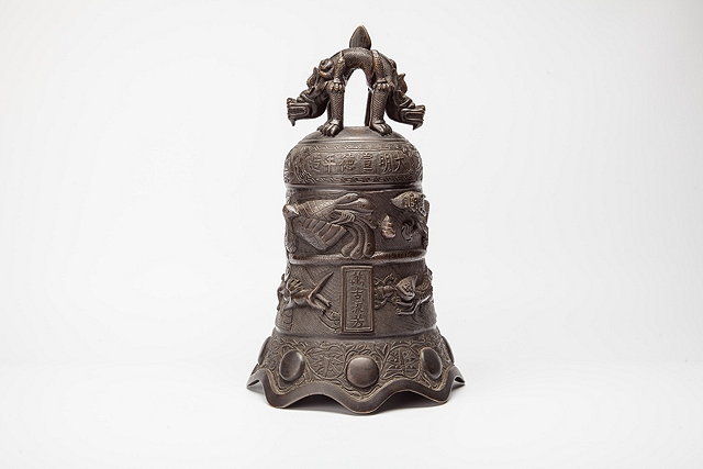 Appraisal: A CHINESE BRONZE TEMPLE BELL with stylised handle raised bands