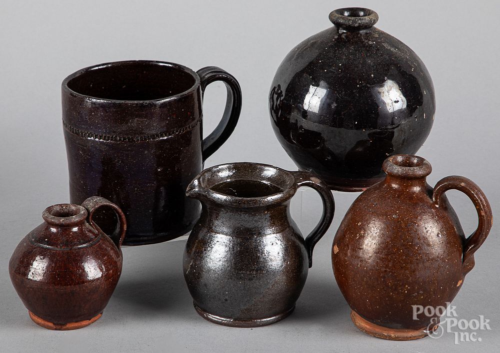 Appraisal: Two small redware ovoid jugs Two small redware ovoid jugs