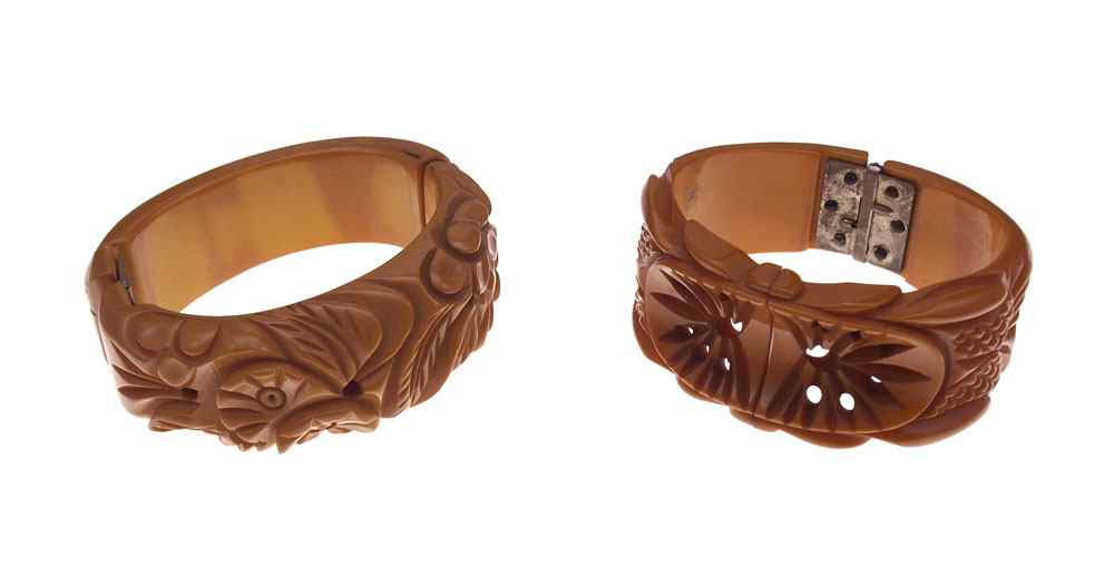 Appraisal: VINTAGE BUTTERSCOTCH BAKELITE HINGED BANGLE BRACELETS Carved and pierced bangle