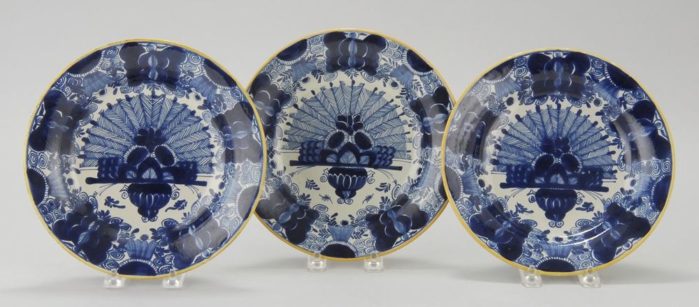 Appraisal: THREE DELFT POTTERY PEACOCK PLATES Early to Mid- th CenturyIn