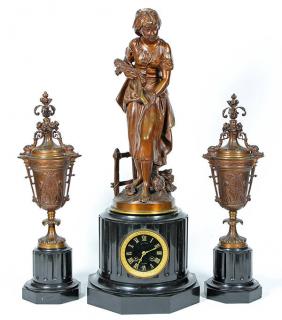 Appraisal: Louis XVI style patinated bronze and black marble figural clock