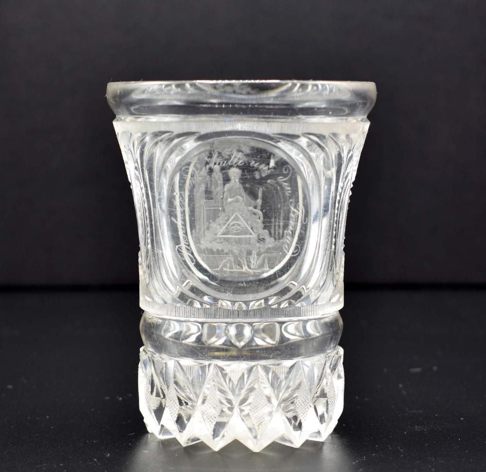 Appraisal: BOHEMIAN ENGRAVED COLORLESS GLASS MASONIC BEAKERCirca The shaped goblet with