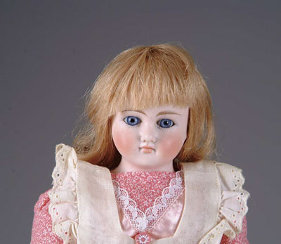 Appraisal: CLOSE-MOUTHED GERMAN A shoulder head glass-eyed German doll on a