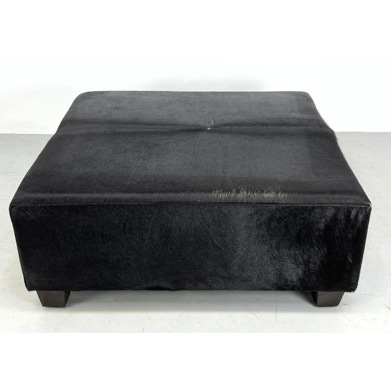 Appraisal: inch PONY HIDE upholstered ottoman Oversized Dimensions H inches W