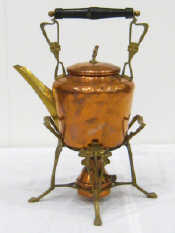 Appraisal: A copper and brass kettle on stand complete with burner