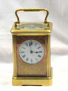 Appraisal: A th century French carriage clock with an engraved mask