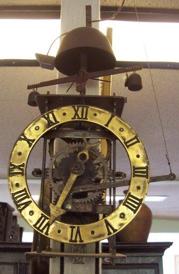 Appraisal: A replica Spanish th Century wall clock with oscillating pendulum