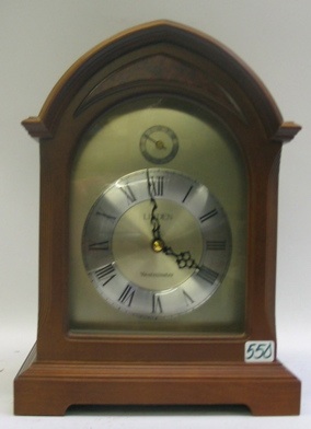 Appraisal: A WALNUT CASED LINDEN MANTEL CLOCK with battery operated Westminster