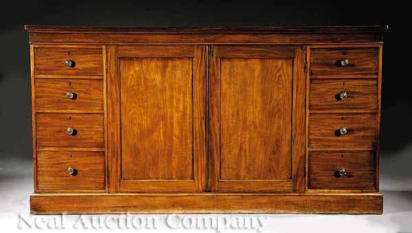 Appraisal: A George III-Style Mahogany Cabinet th c rectangular molded top