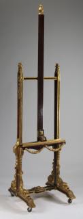 Appraisal: Carved and parcel gilt mahogany easel Parcel gilt carved mahogany