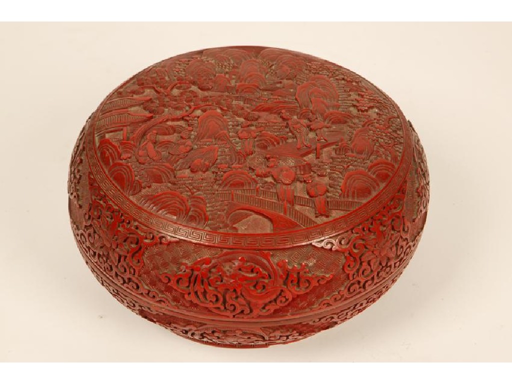 Appraisal: A CHINESE CINNABAR LACQUER CUSHION-SHAPED BOX carved with figures beside