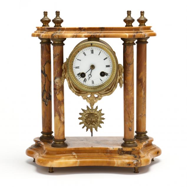 Appraisal: FRENCH MARBLE AND ORMOLU PORTICO CLOCK Early th century sienna