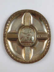 Appraisal: A Britannia silver oval plaque by Christopher Lawrence commissioned by