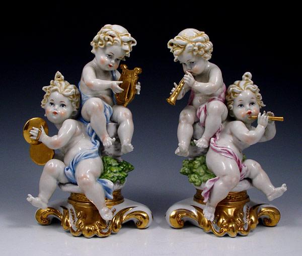 Appraisal: PAIR CAPO DI MONTE PUCCI CHERUB FIGURES Each musical team