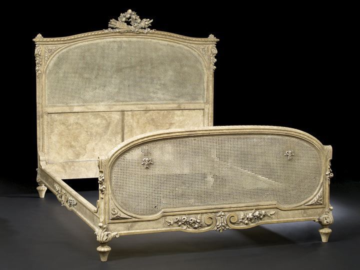 Appraisal: French Carved and Blanc-de-Trianon-Painted Beechwood and Cane Double Bedstead in