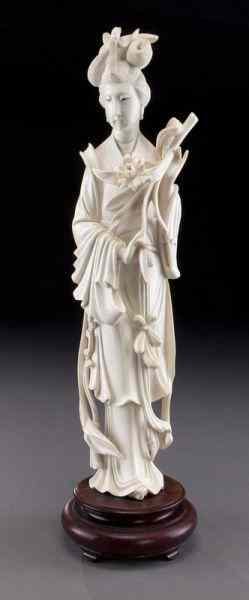 Appraisal: Chinese carved ivory lady holding flowers International buyers should note