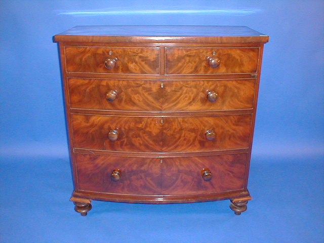 Appraisal: A Victorian flamed mahogany bow front chest of two short