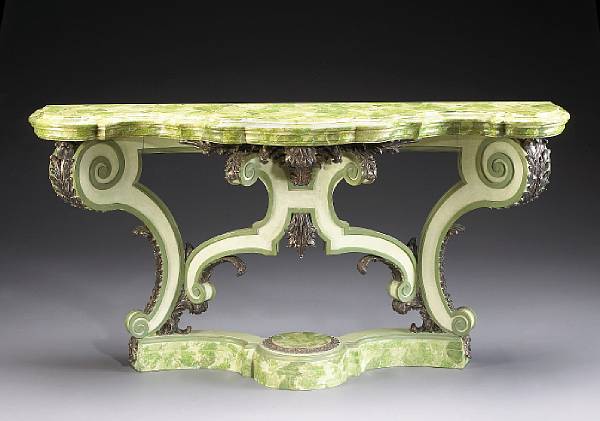 Appraisal: A Portuguese Rococo style silver gilt and faux marble console