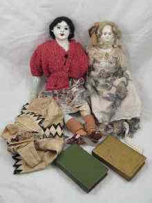 Appraisal: Two porcelain dolls with fabric bodies and upper limbs one