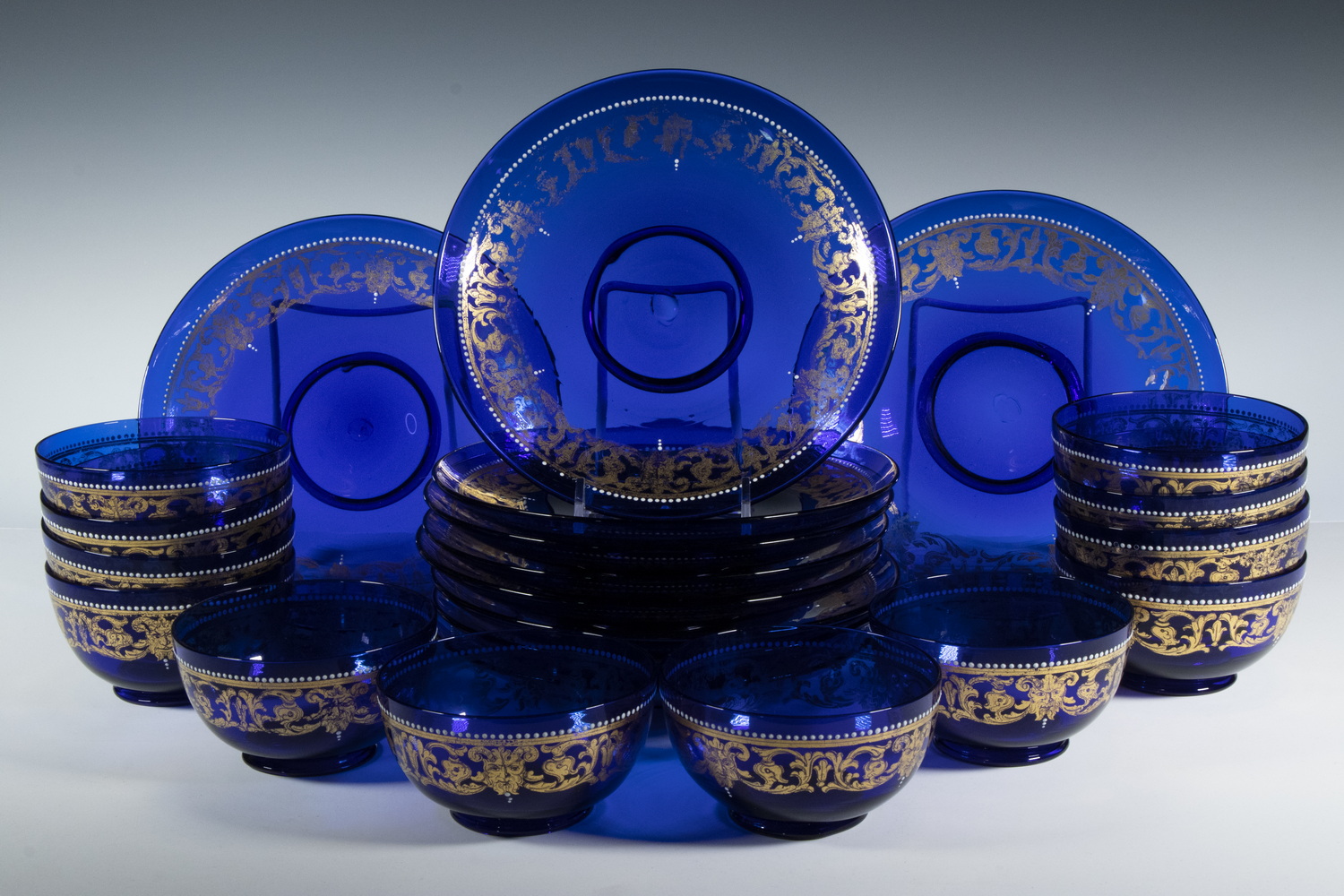 Appraisal: COBALT BLUE GLASS PLATES BOWLS Piece Set of Gilt and