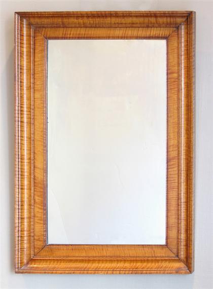 Appraisal: Classical tiger maple framed looking glass Rectangular molded frame enclosing