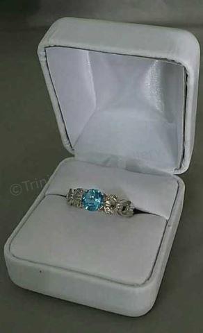 Appraisal: Sterling Silver Genuine Blue Topaz Ring Type Modern design right