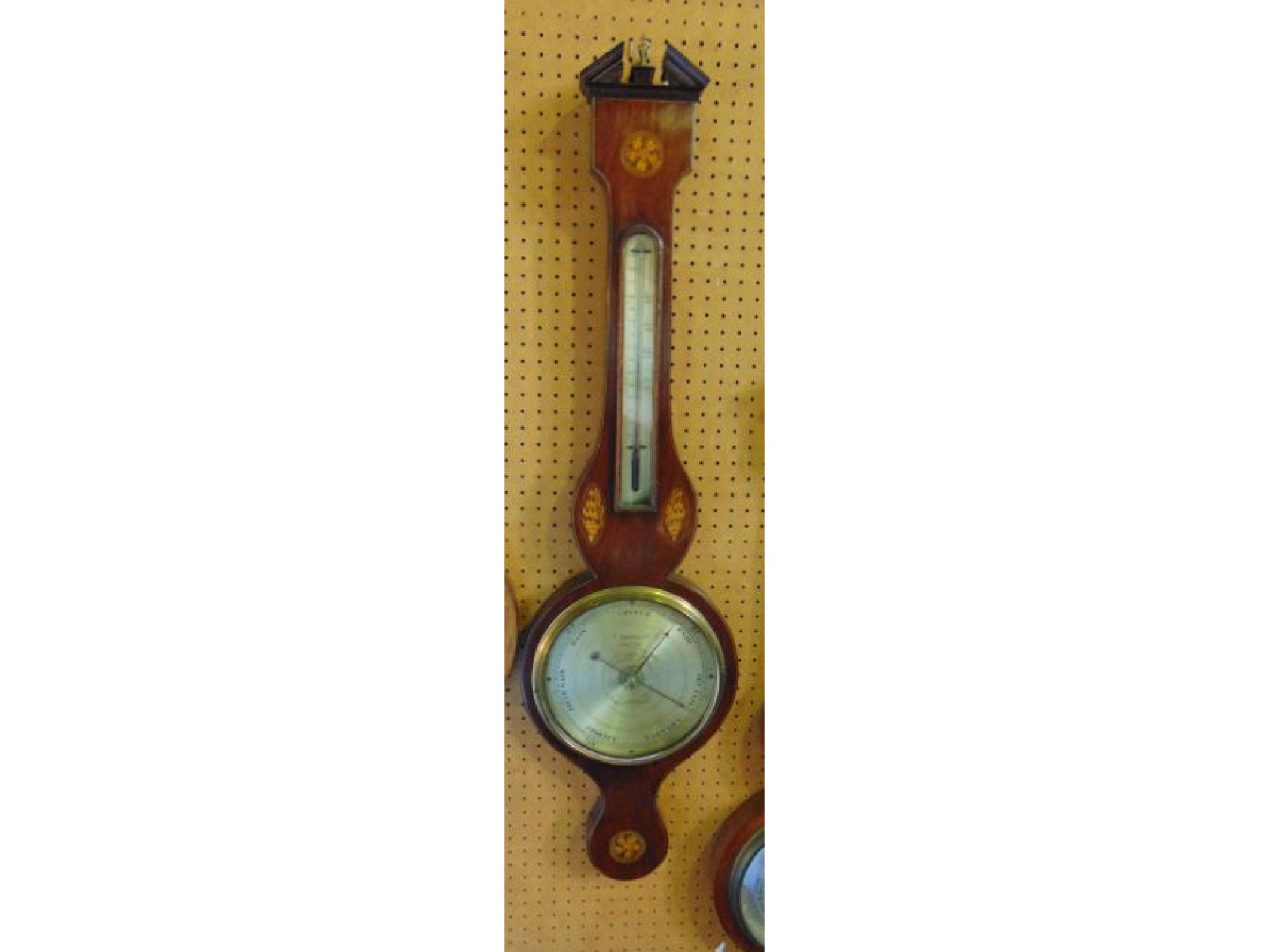 Appraisal: A Georgian mahogany wheel barometer the case work with box