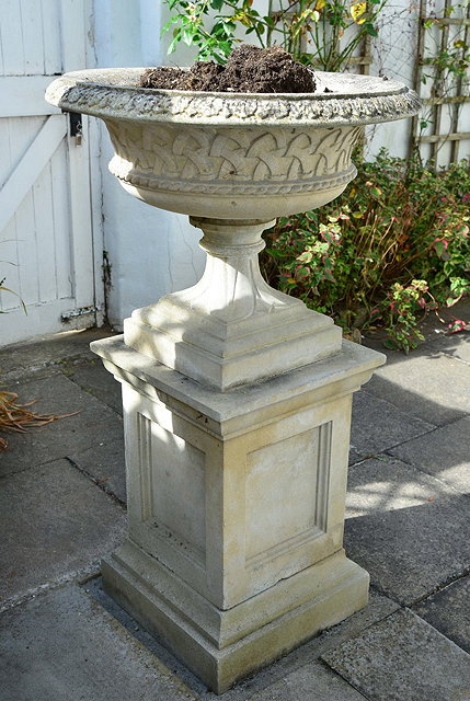 Appraisal: A LARGE RECONSTITUTED STONE URN on pedestal cm high cm