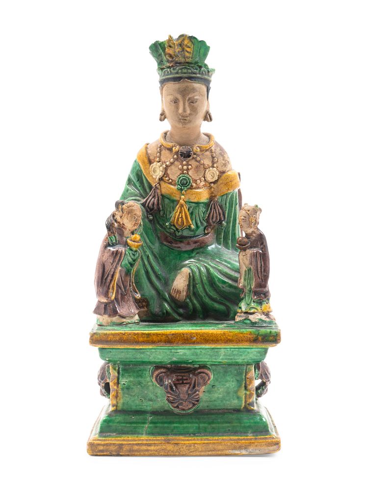 Appraisal: A Chinese Sancai Glazed Stoneware Figure of Seated Guanyin Height