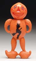 Appraisal: RARE CELLULOID DOUBLE-FACED VEGETABLE-MAN RATTLE Orange double-faced rattle with silhouettes