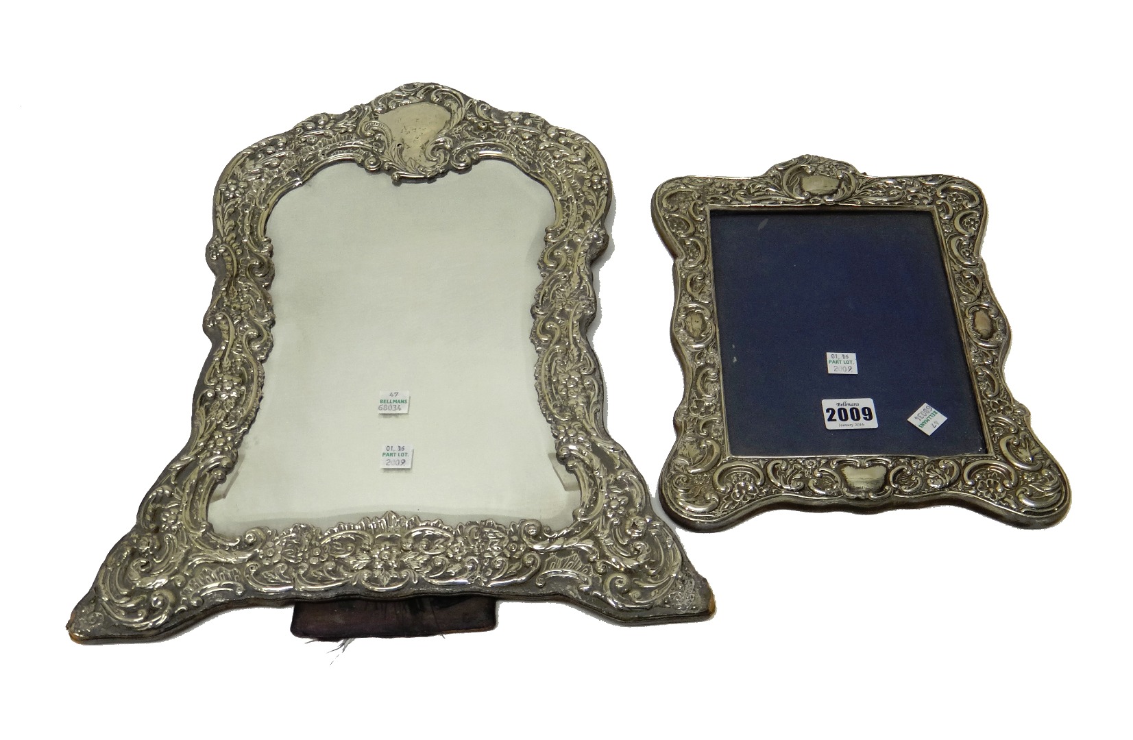 Appraisal: A late Victorian silver mounted shaped rectangular strut backed mirror