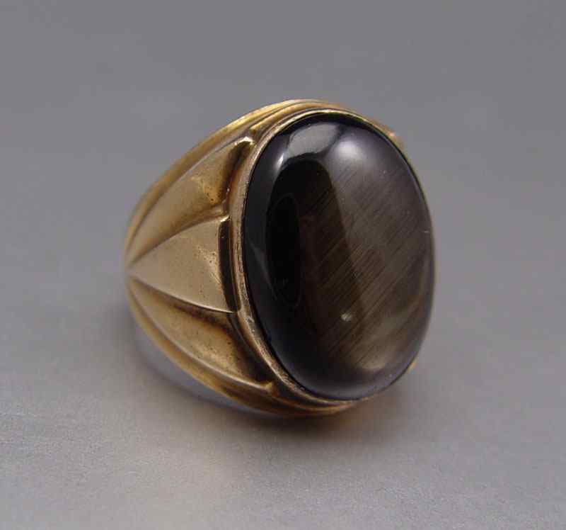 Appraisal: CT BLACK STAR SAPPHIRE RING K yellow gold ring contains