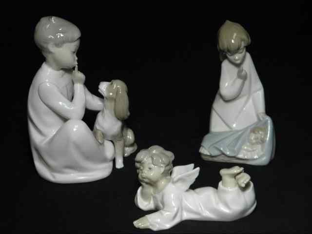 Appraisal: Lot of three Lladro Spanish porcelain figurines Includes ''Angel Reclining''